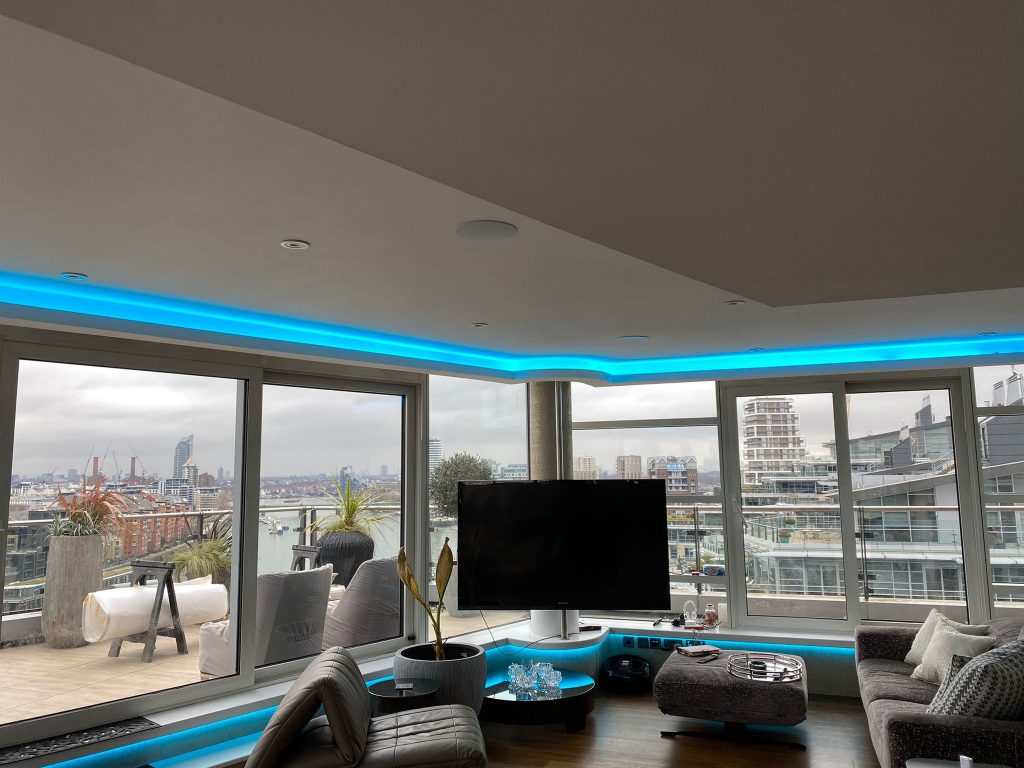 London city view apartment with cyan illuminated curved cove